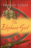 book cover for The Elephant Girl by Henriette Gyland. Red and gold background with image of a dagger and and an elephant pendant